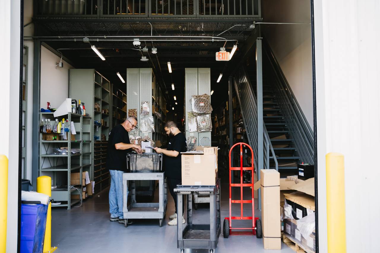 Sun State International parts team pulling and verifying components at the parts counter