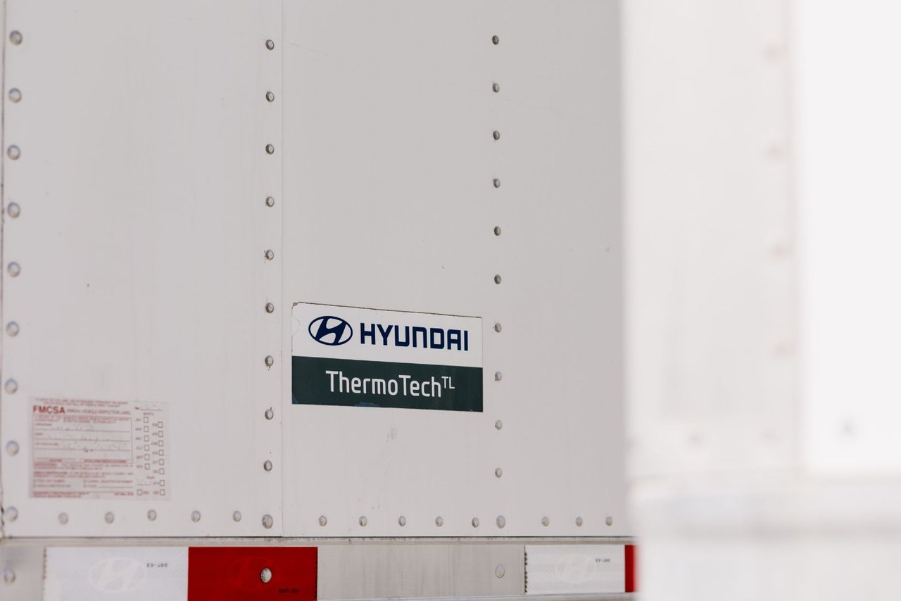 Close-up of a Hyundai Translead ThermoTech reefer unit label on a trailer wall