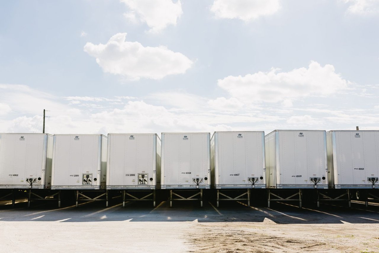 Row of used Hyundai Translead reefer trailers parked at a Sun State Trailers lot