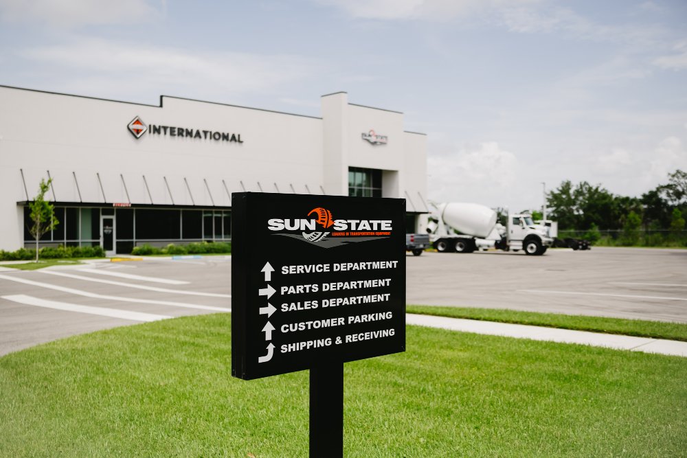 Sun State International dealership building and wayfinding sign at the Tampa location