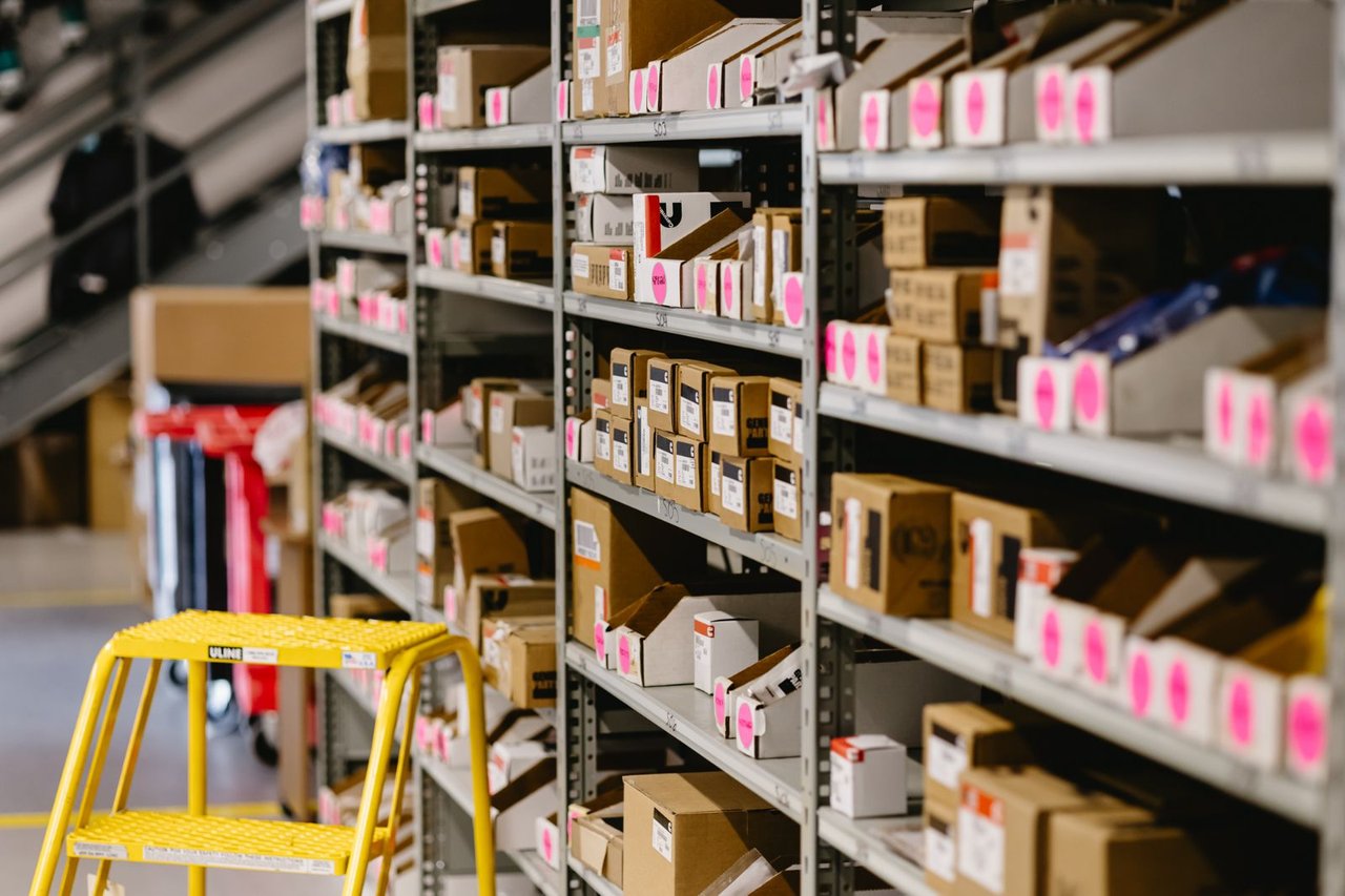 Sun State Trailers parts warehouse shelving with labeled inventory boxes