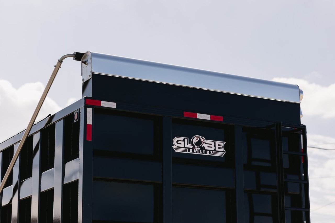 Close-up of a used Globe dump trailer's rear tailgate and body construction