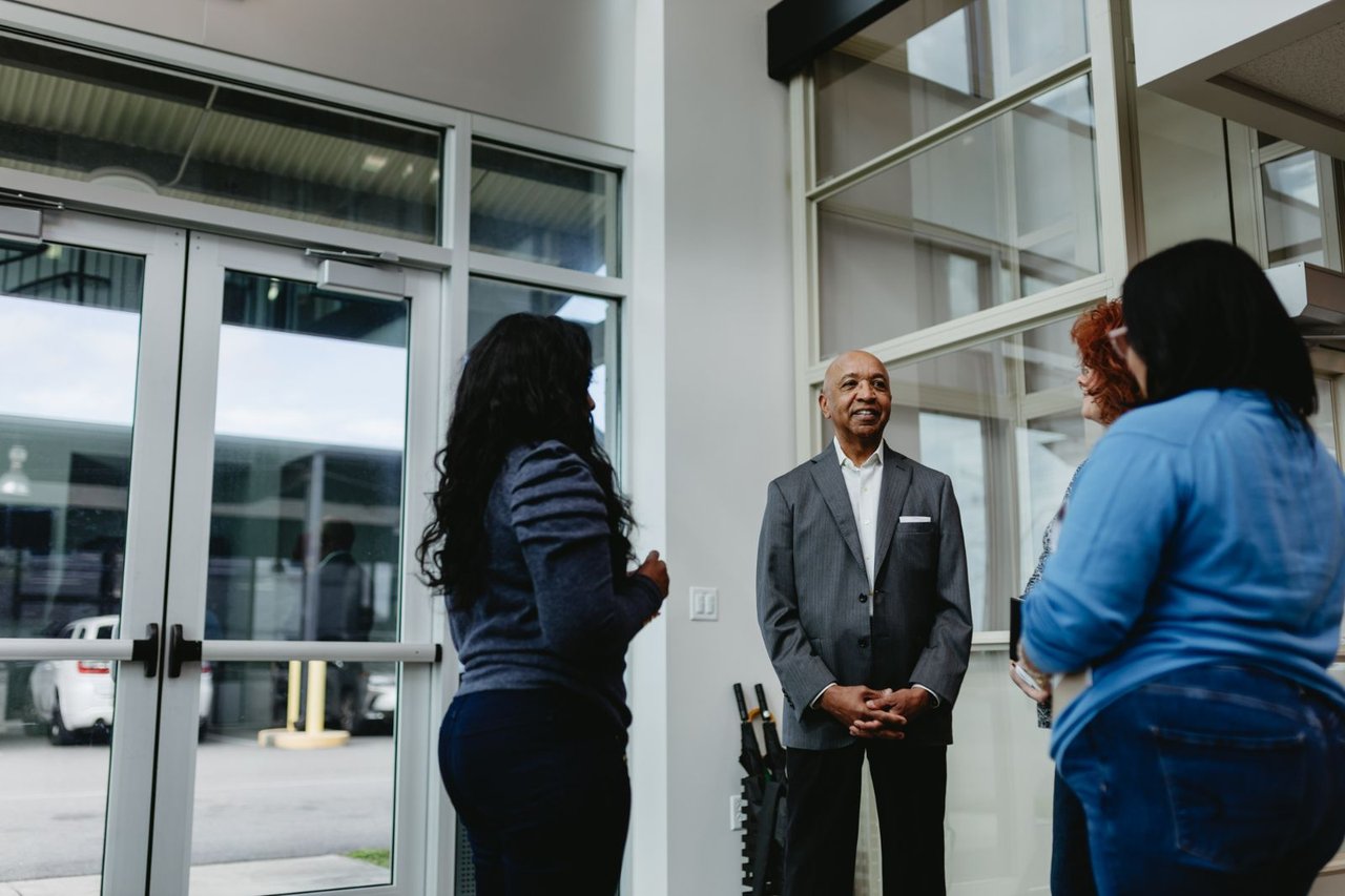 Sun State team member greeting visitors at the dealership entrance