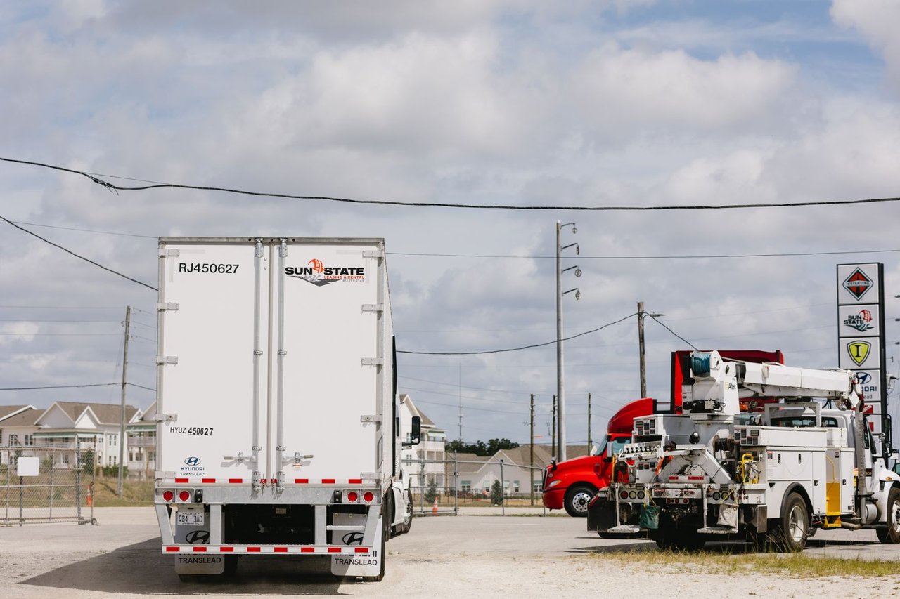Sun State Translead trailer and service truck parked at the yard