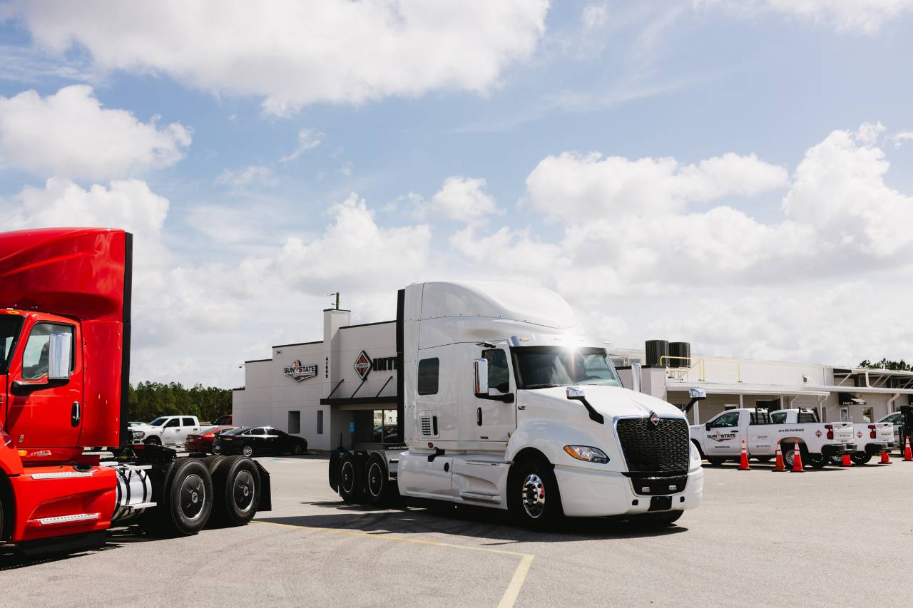 Serviced International truck parked outside a Sun State International dealership