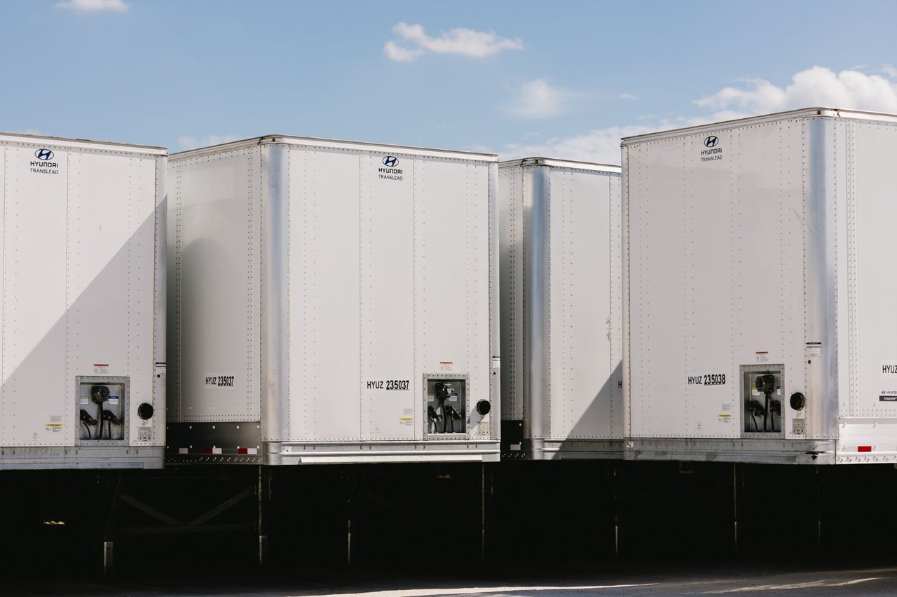 Row of standardized Hyundai Translead trailers parked side by side