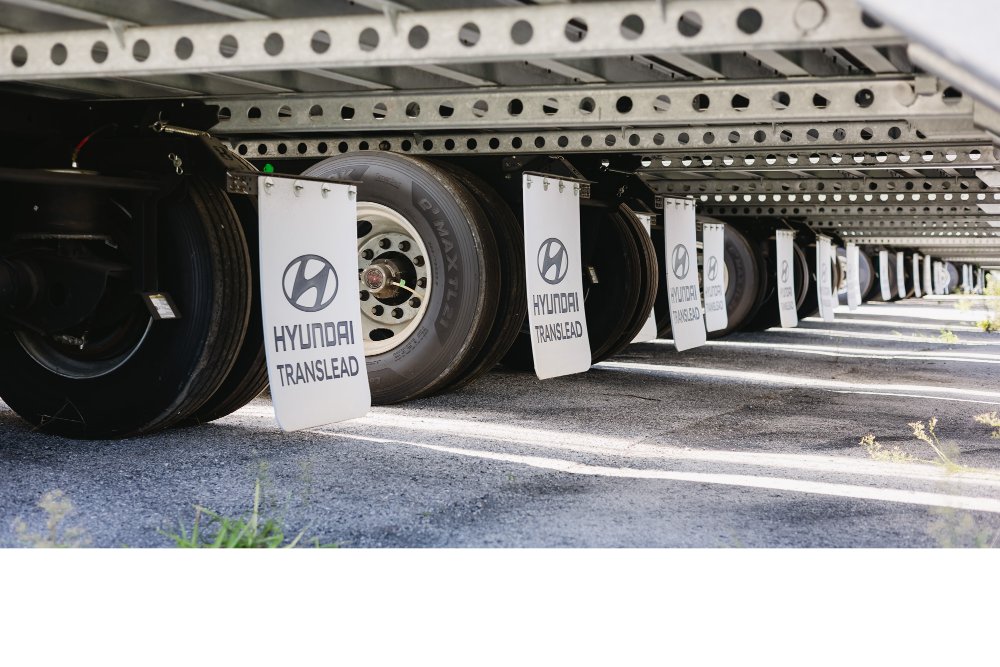 Row of Hyundai Translead trailer wheels and mudflaps at Sun State Trailers