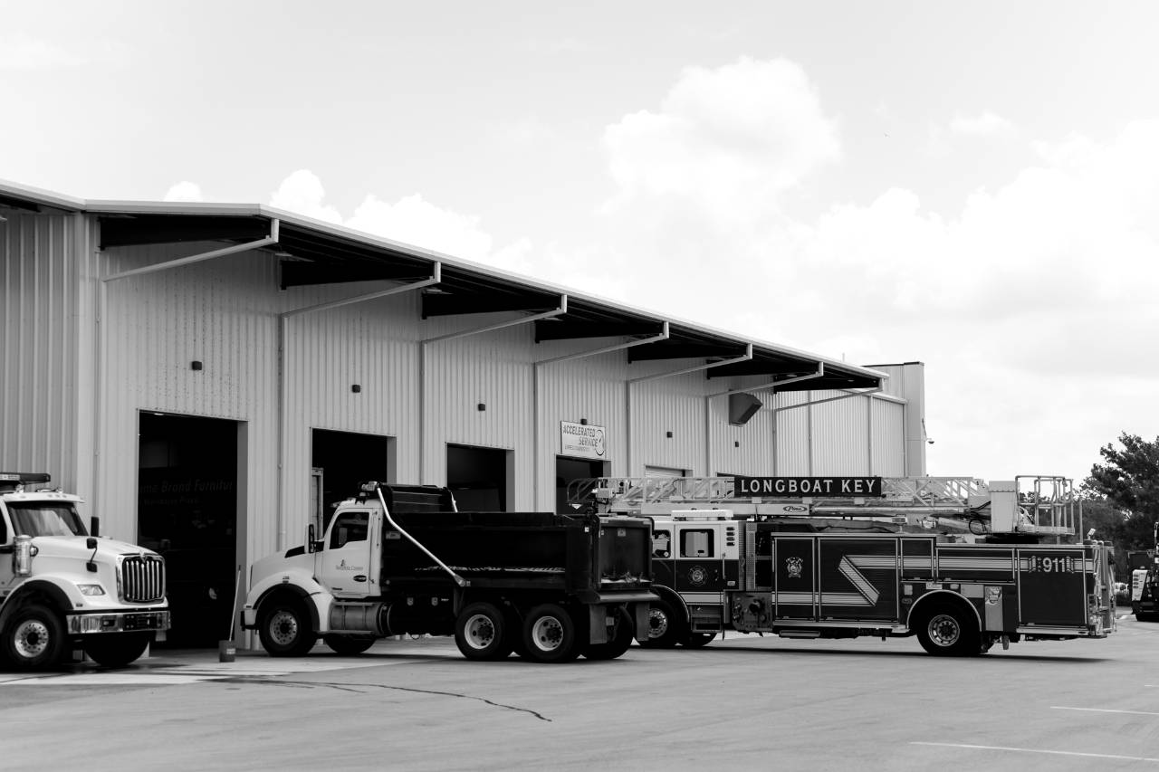 Sun State International service center exterior with truck bays and customer parking